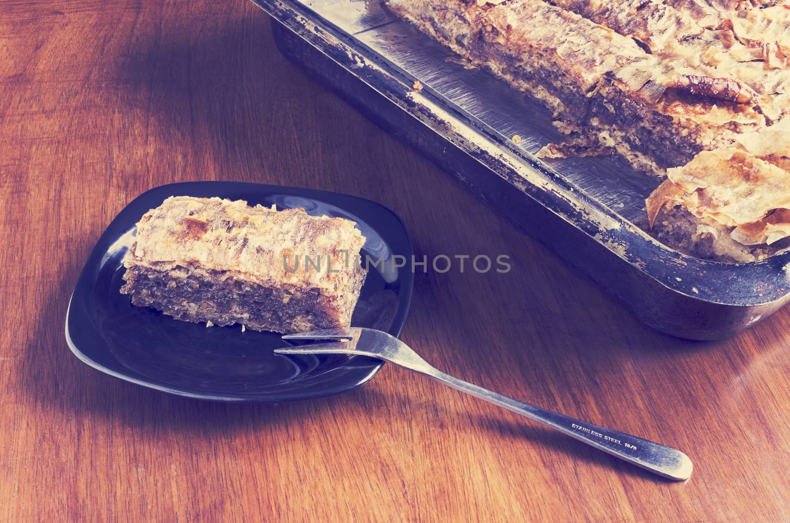 Walnut pie, a traditional dessert in the Balkans, photo with colorful toned vintage filter effect