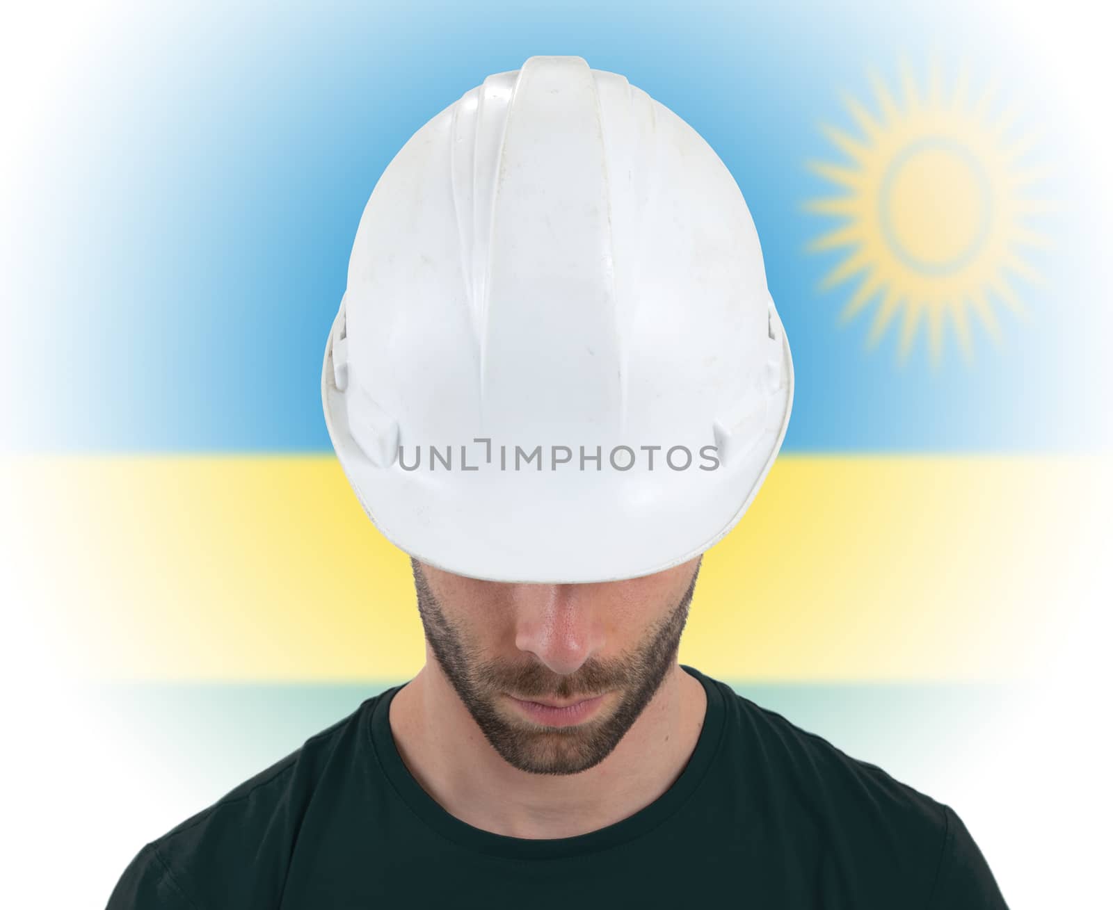 Isolated engineer with flag on background - Rwanda