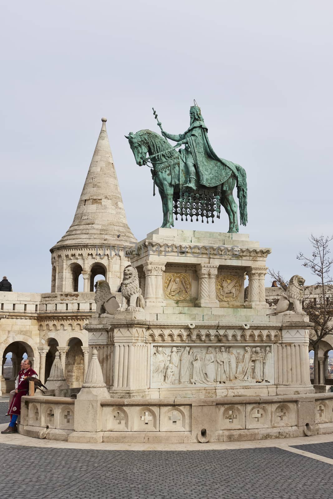 BUDAPEST, HUNGARY - FEBRUARY 02: Bronze statue of Saint Stephen, in the Old Town district, with Fisherman's Bastion spire in the background. February 02, 2016 in Budapest.