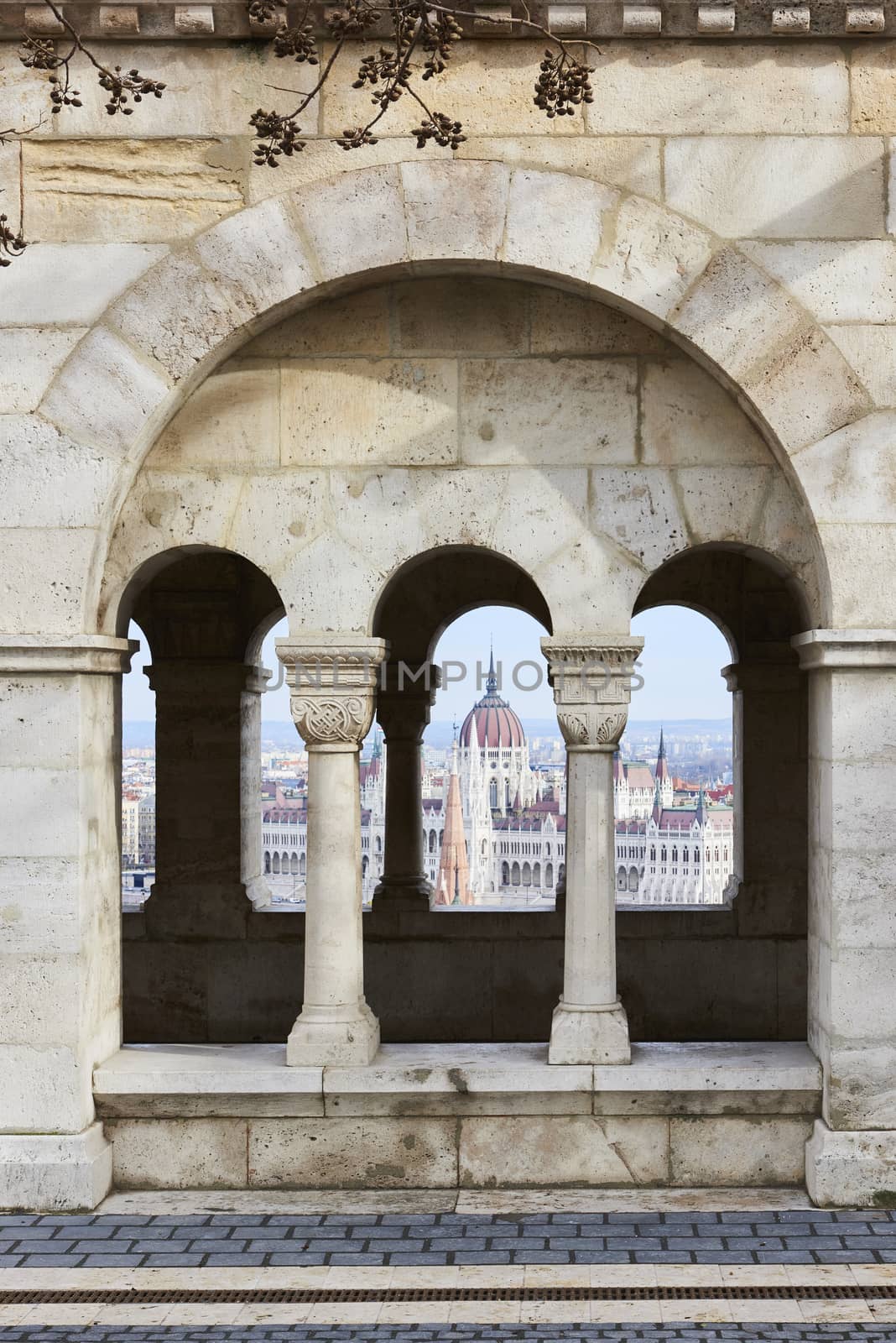 BUDAPEST, HUNGARY - FEBRUARY 02: Hungarian Parliament building seen from between Fisherman's Bastion's arches, at the Old Town district. February 02, 2016 in Budapest.