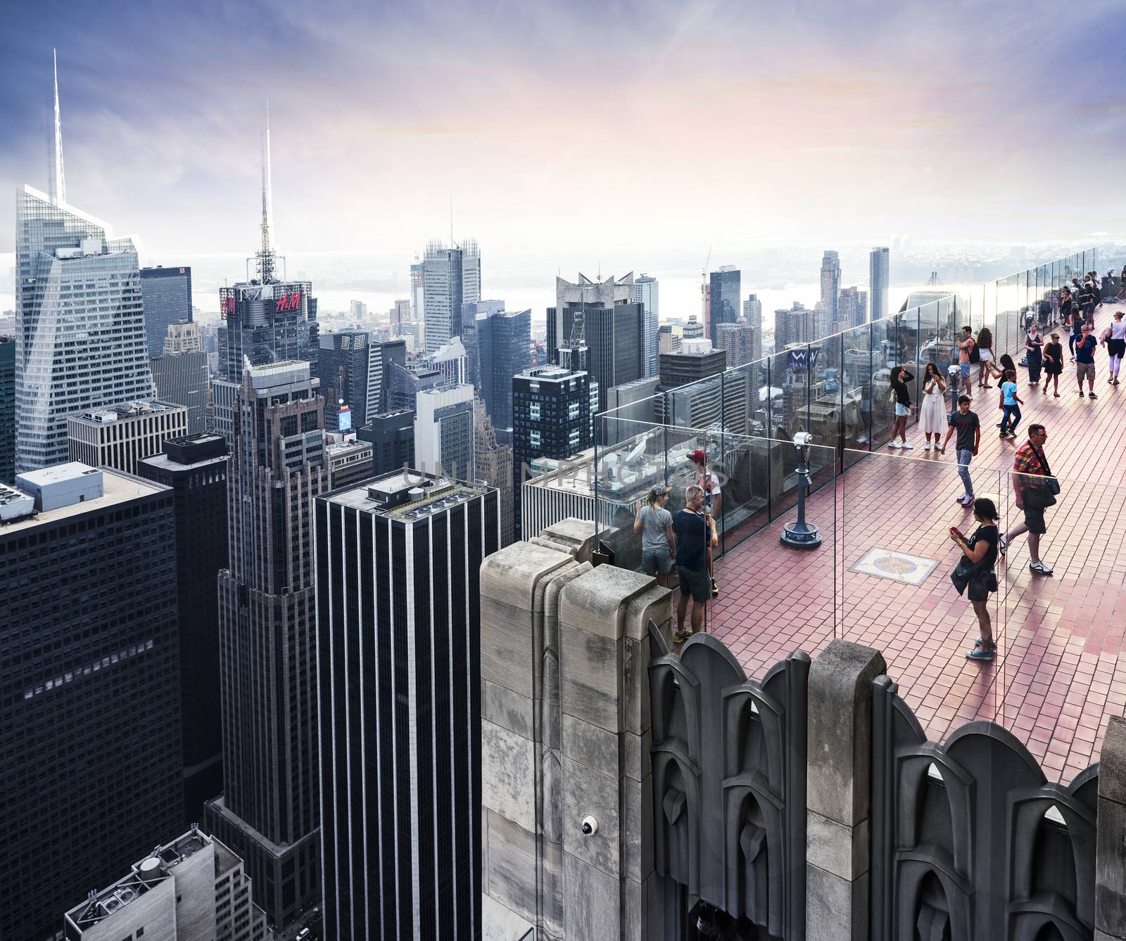 NEW YORK CITY -JULY 11: Skyline and times Square, featured with tourist people on a roof, is a symbol of New York City and the United States, July 11, 2015 in Manhattan, New York City. USA.