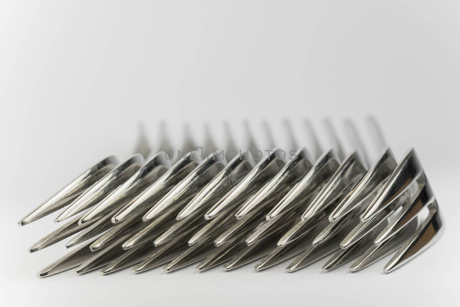 Abstract collection of metal forks
