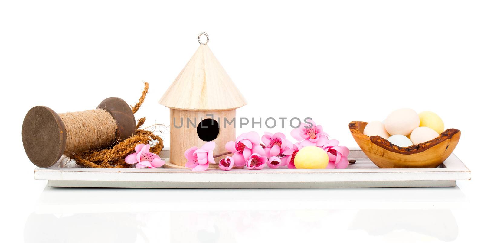 Easter eggs with birdhouse and easter decoration, isolated on white background
