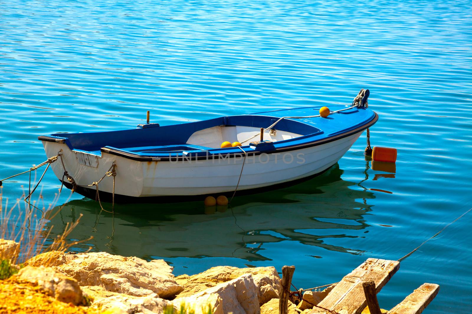 One fishing boat floating on the water