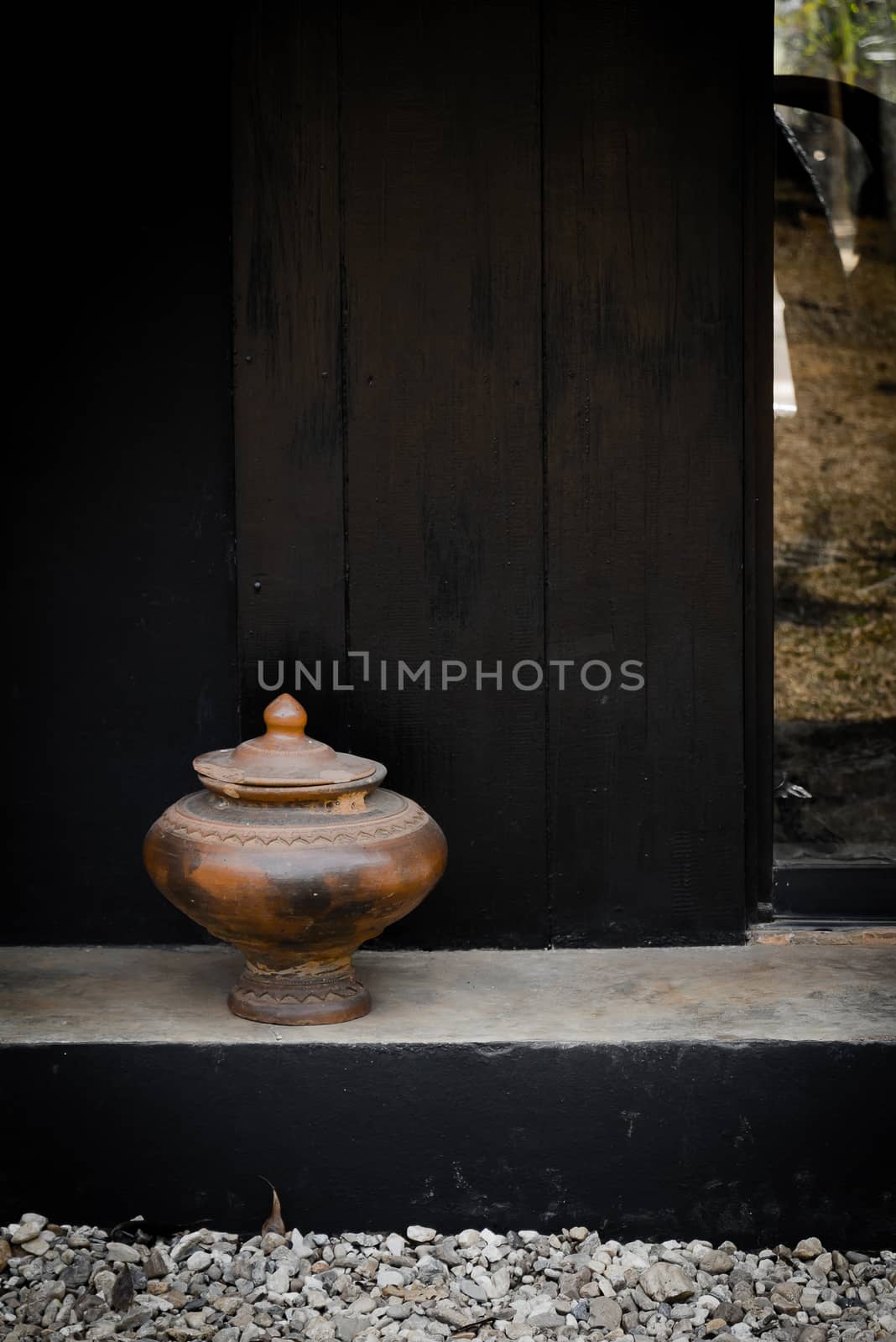Pottery drinking water jar from northen thailand background