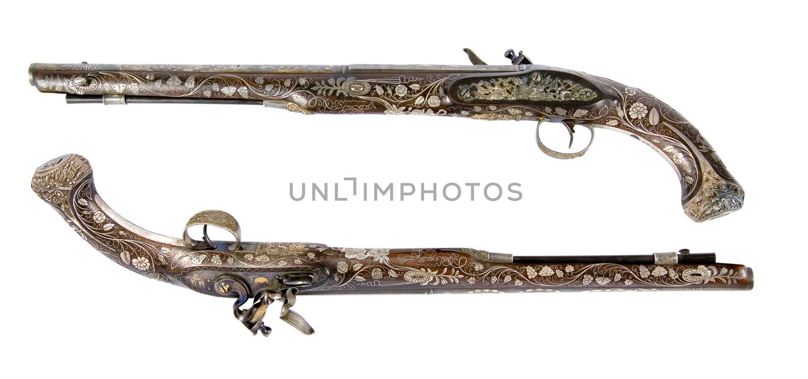 Old pistol inlaid with bone and enamel. Ceremonial weapon