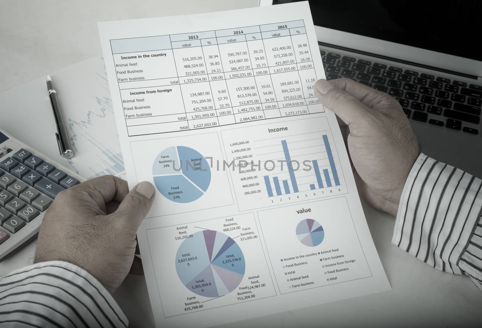 businessman analyzing data report on work desk.Vintage Style.