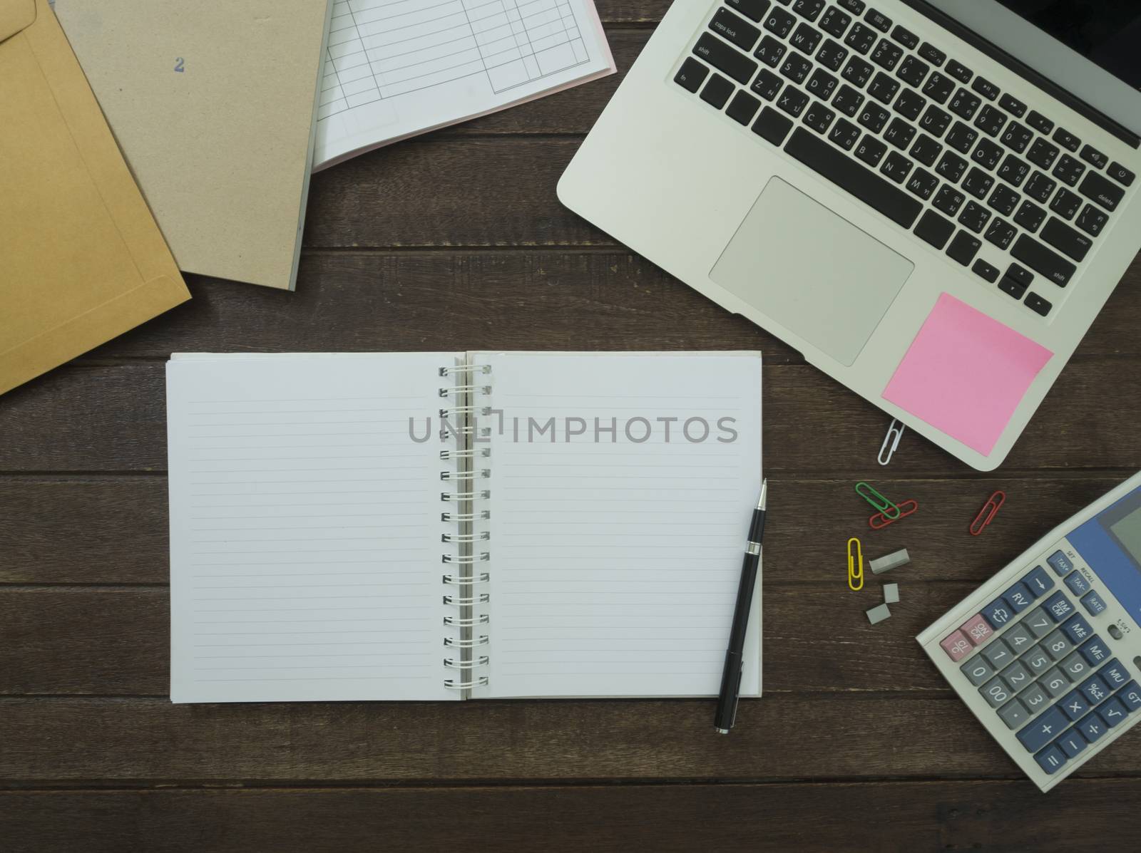 notebook, laptop,Calculator on desk. working concept