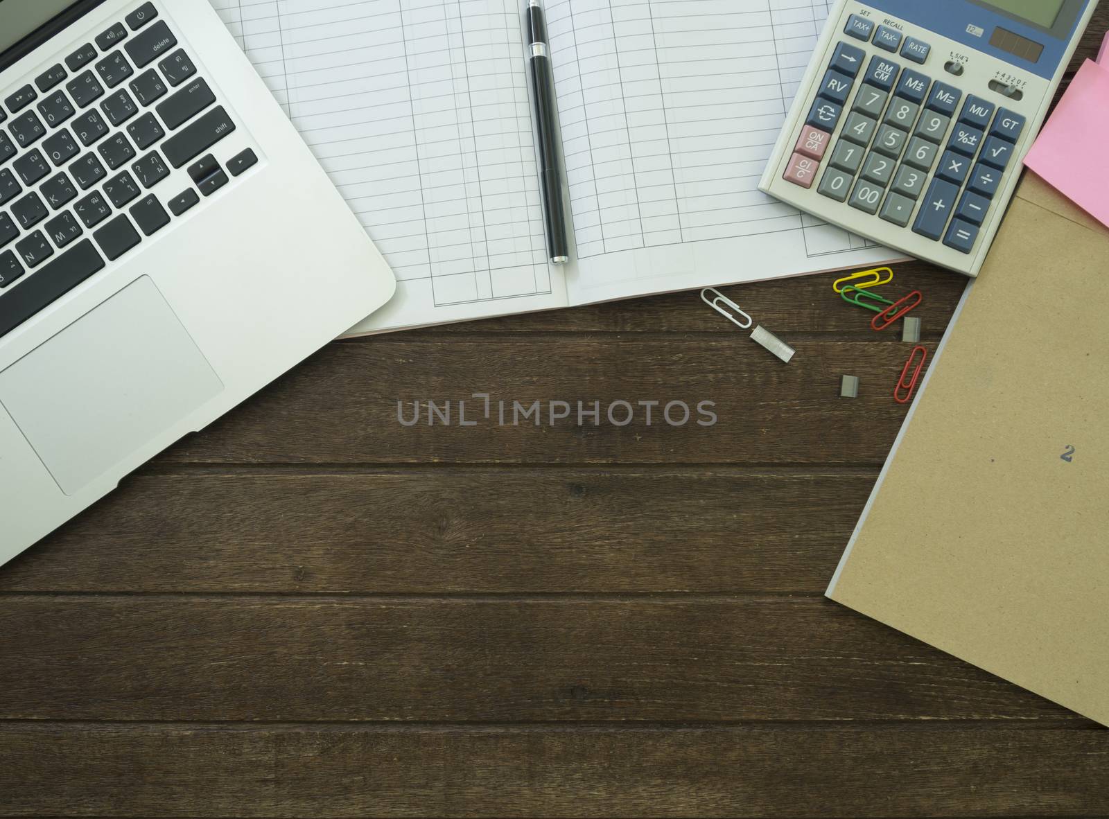 laptop,Calculator,account book, on desk.working concept