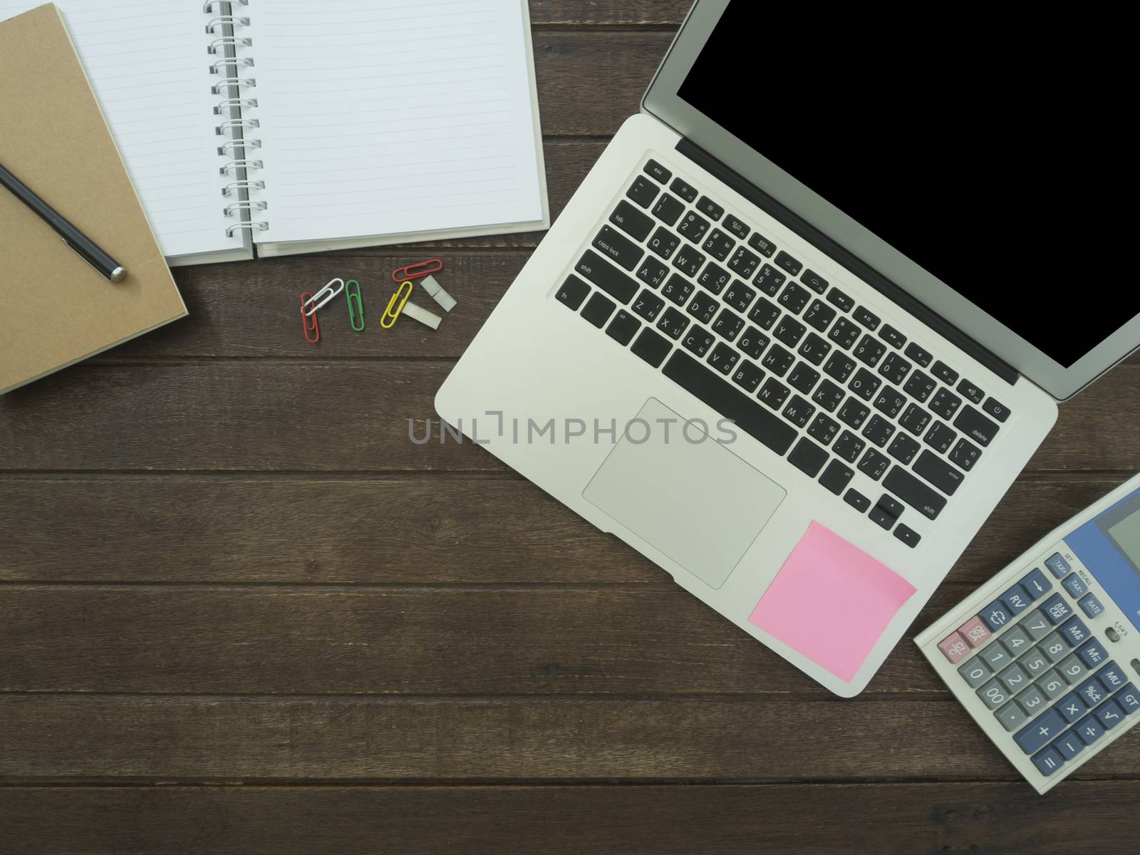notebook, laptop,Calculator on desk. working concept