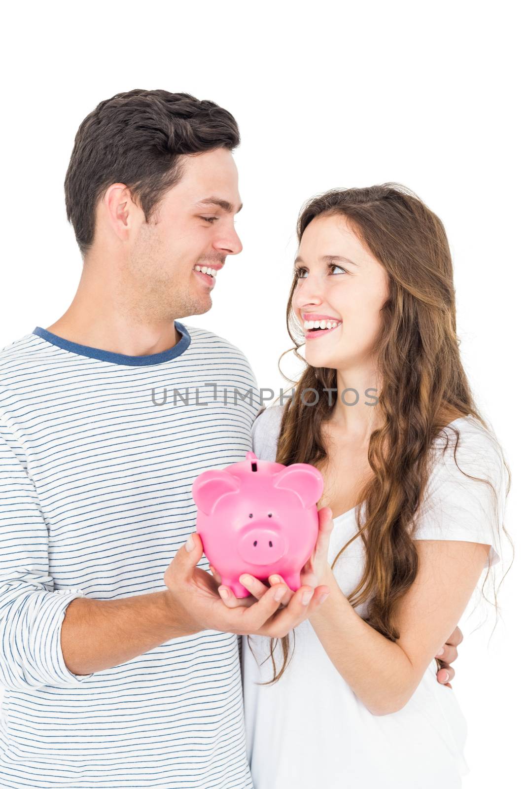 Couple holding piggy bank by Wavebreakmedia