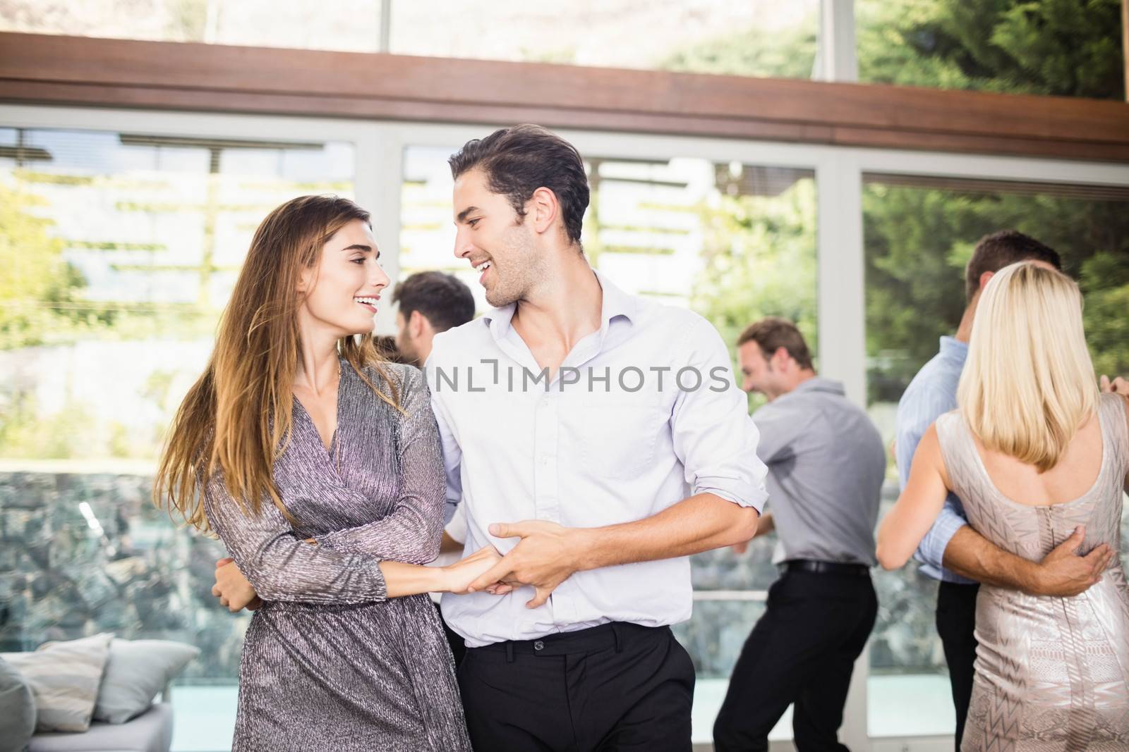 Group of young friends dancing by Wavebreakmedia