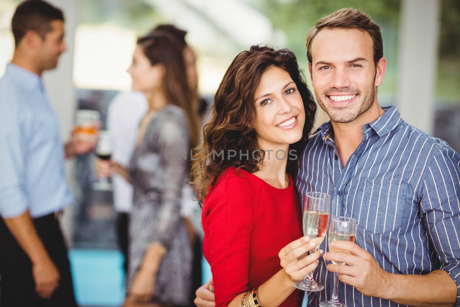 Romantic couple having drinks at the party