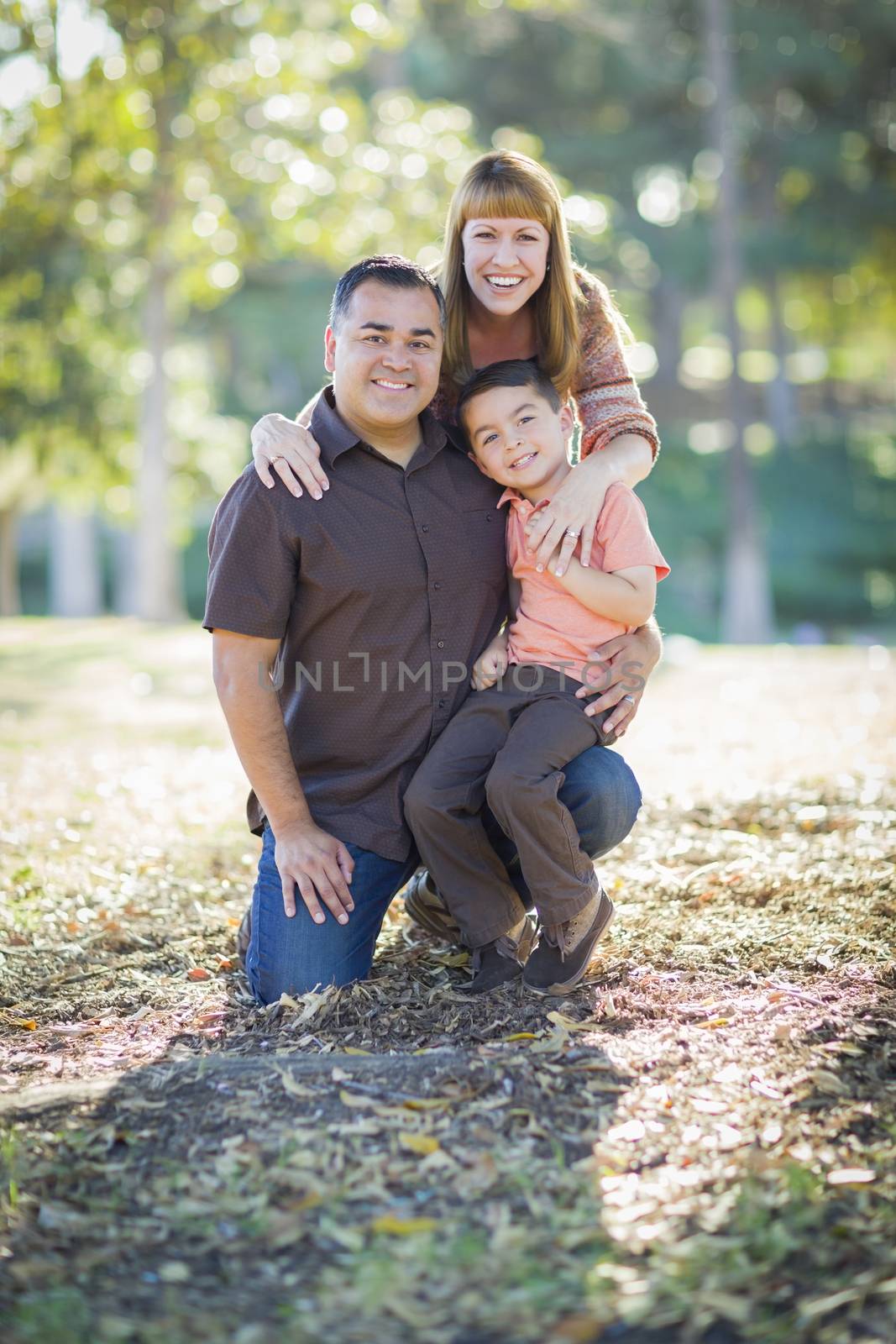 Happy Attractive Young Mixed Race Family Portrait Outdoors.