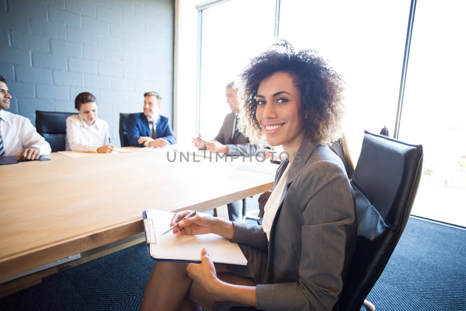Business people discussing in meeting at conference table in office