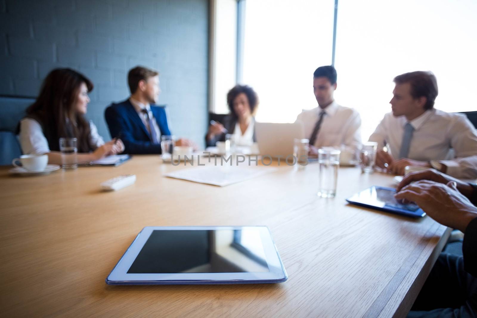 Businesspeople in conference room during meeting by Wavebreakmedia