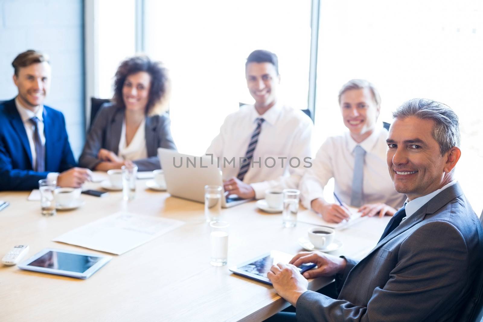 Portrait of businesspeople in conference room during a meeting
