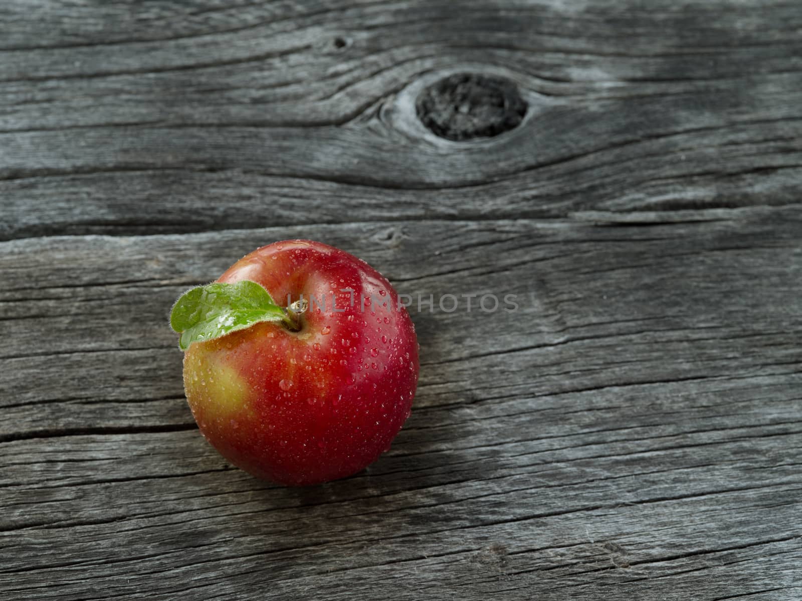 close up view of nice fresh apple on wooden  background