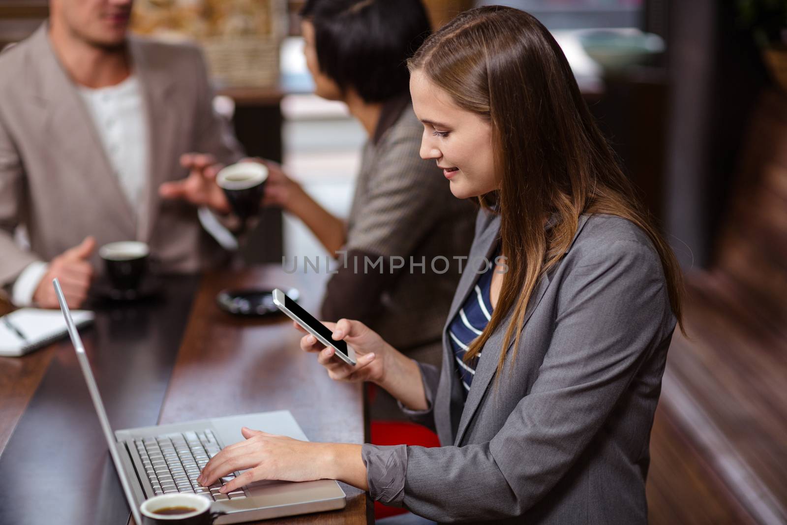 Woman using technology in a cafe