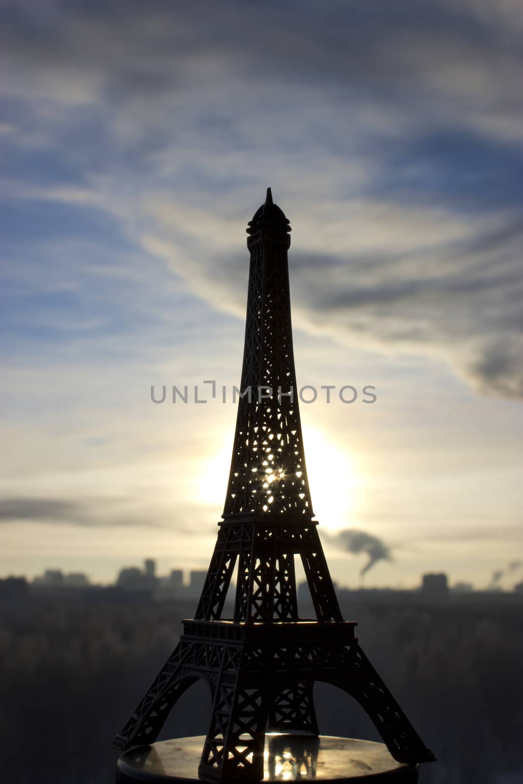 miniature of  Eiffel Tower placed in winter landscape