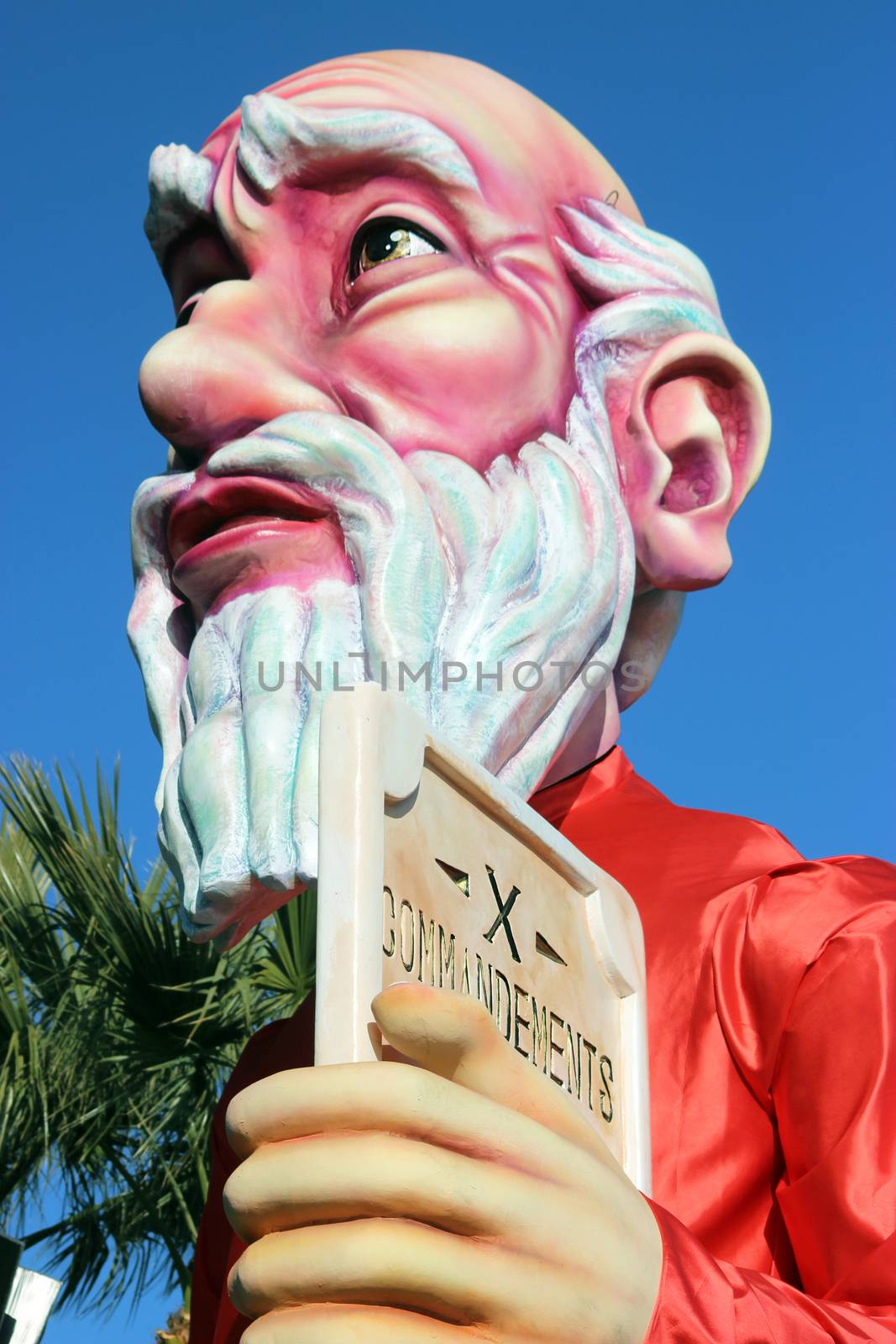 Nice, France - February 21 2016: Caricature of Moses and The Ten Commandments (Prophet). Parade Float during the Carnival of Nice (Corso Carnavalesque 2016) in French Riviera. The Theme for 2016 was King of Media