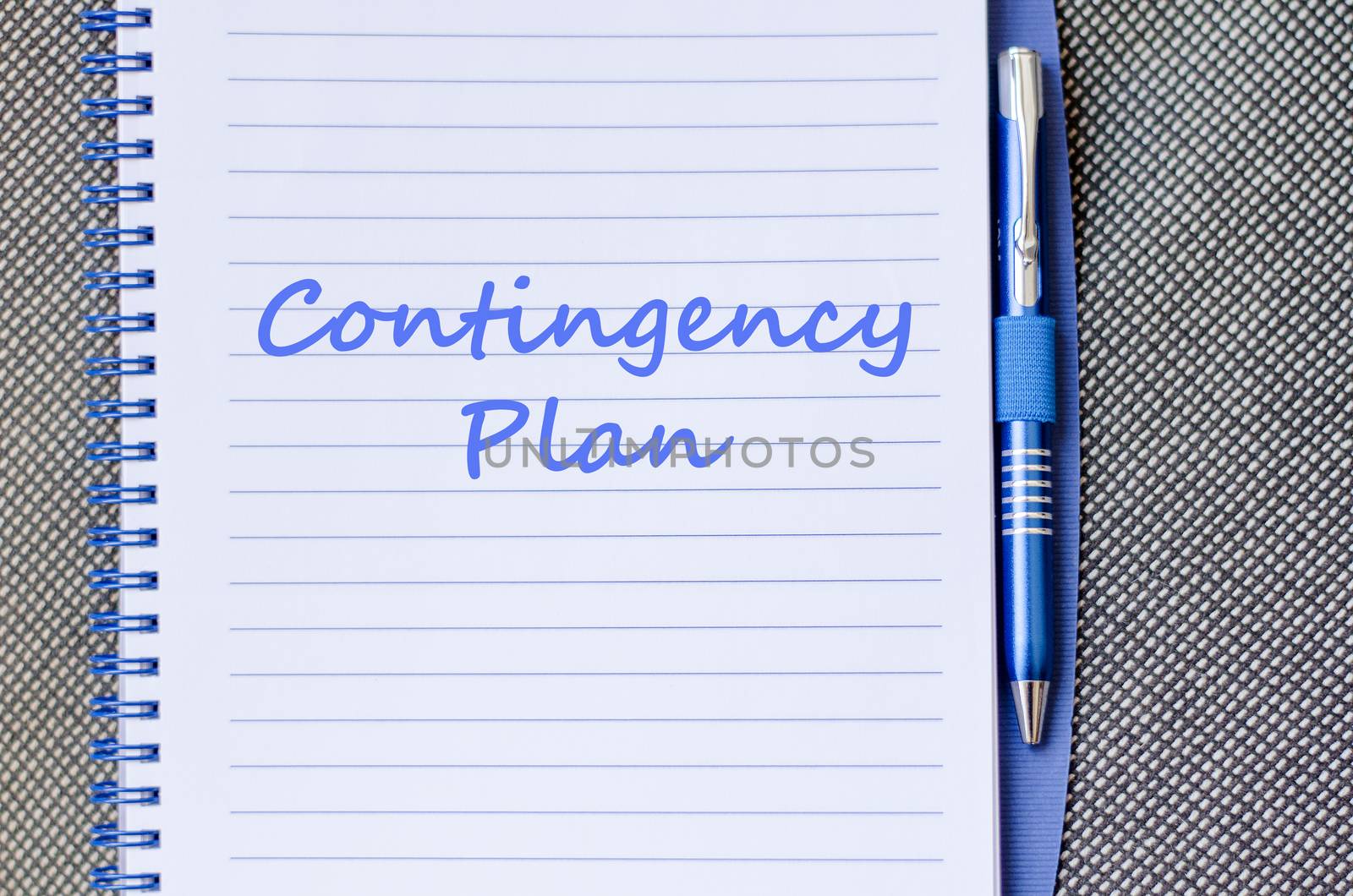 Contingency plan text concept write on notebook with pen