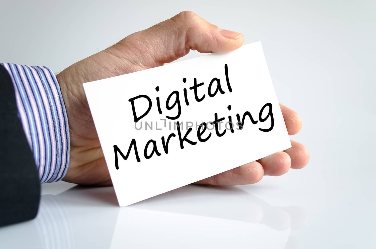 Business man hand writing digital marketing