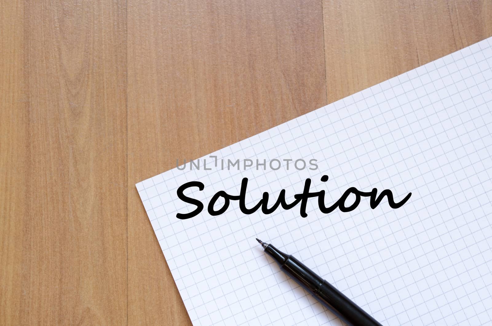 Solution text concept write on notebook with pen