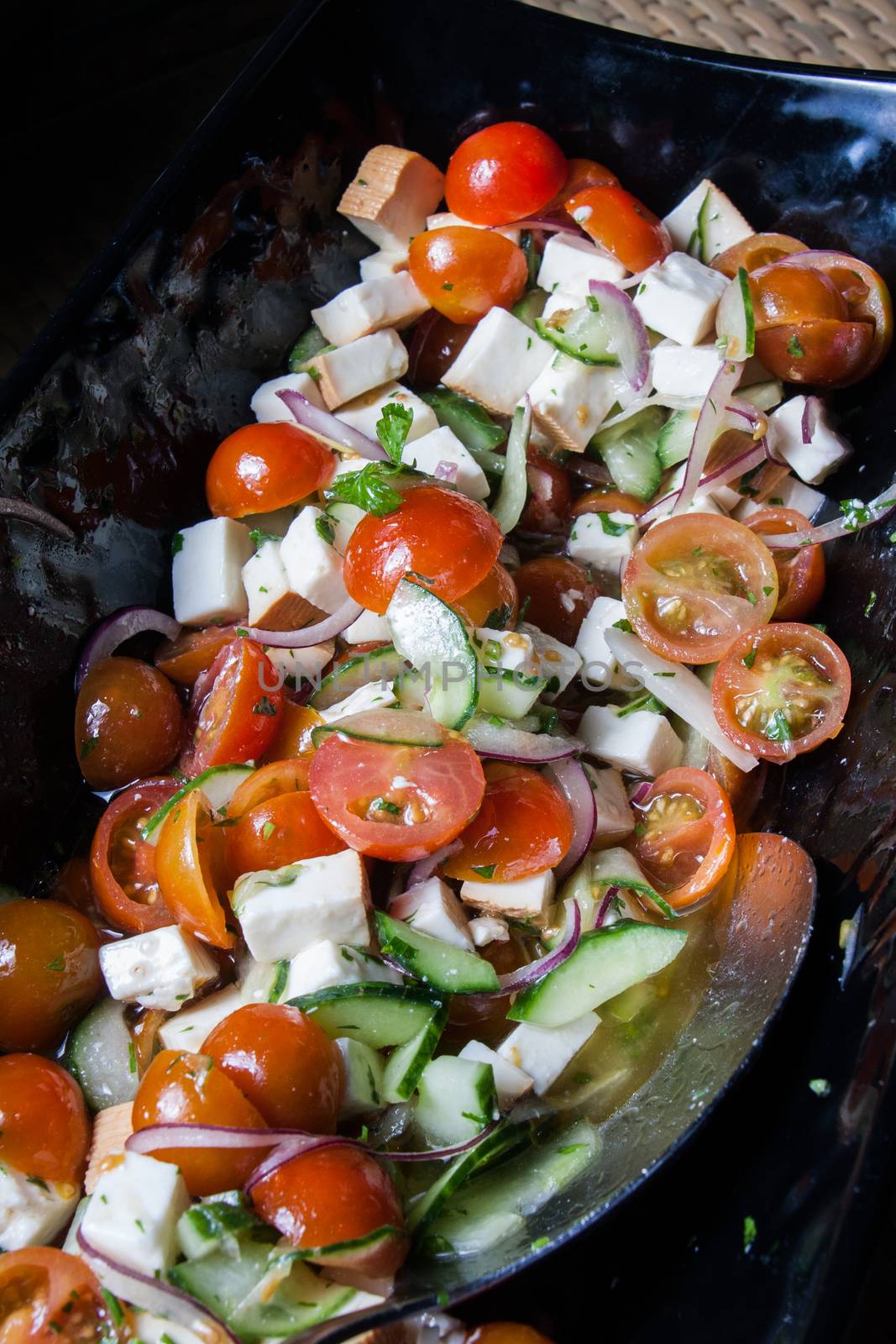 salad with fresh tomatoes cherry cheese lettuce onion and cucumber