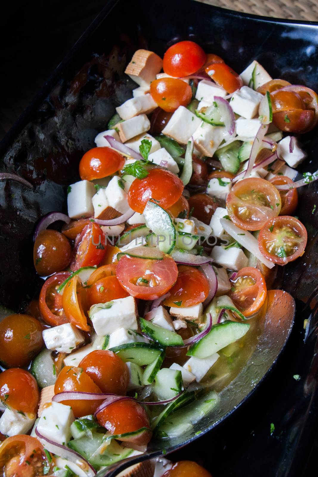 salad with fresh tomatoes cherry cheese lettuce onion and cucumber