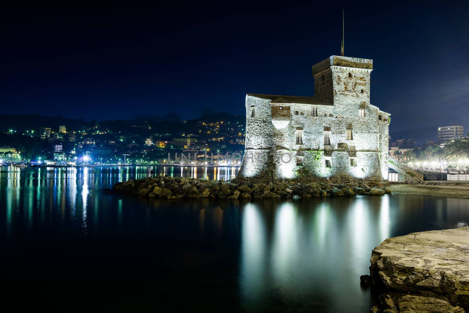 The ancient castle of Rapallo, built on the ligurian sea illuminated by night.