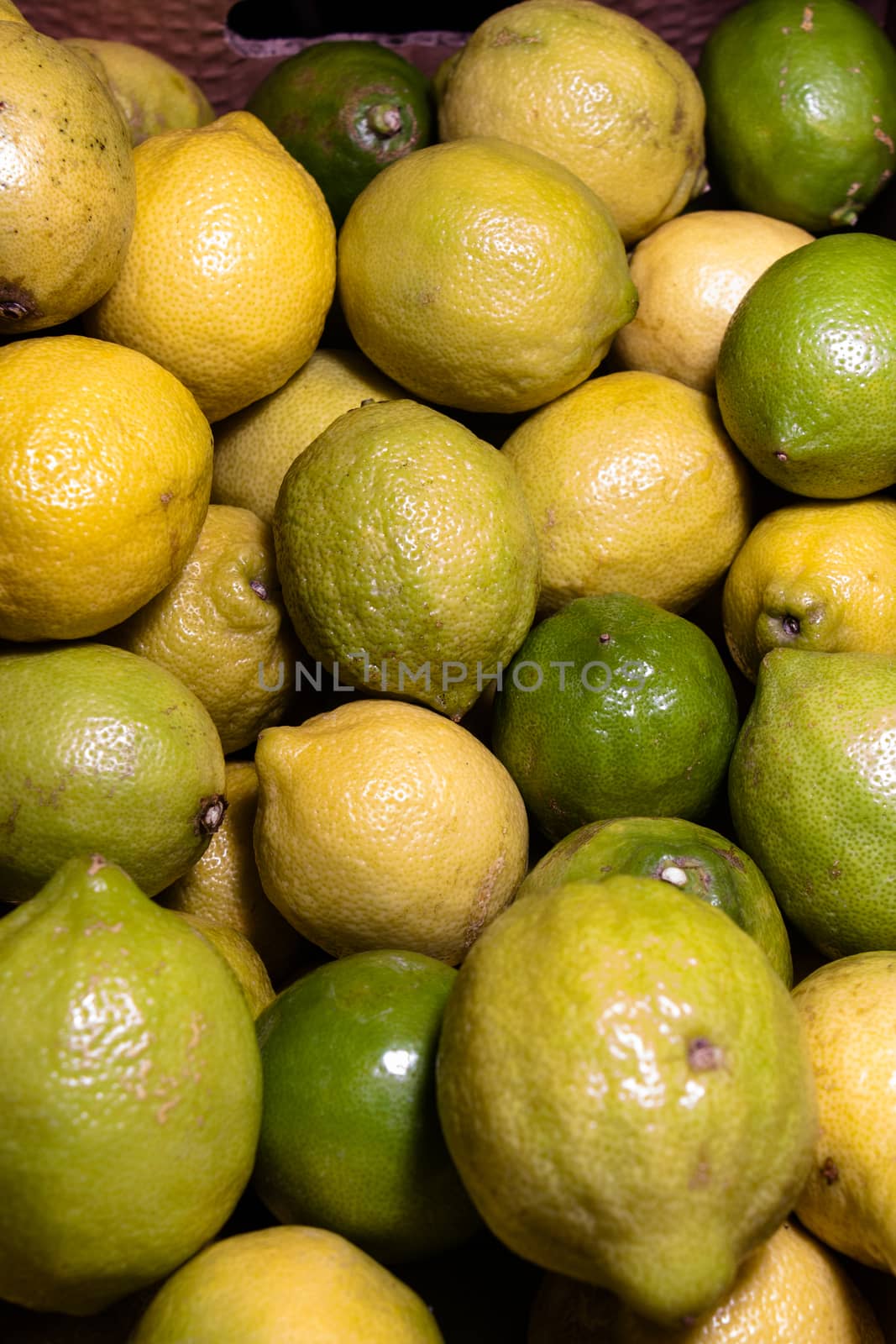 stack of fresh lemons and limes