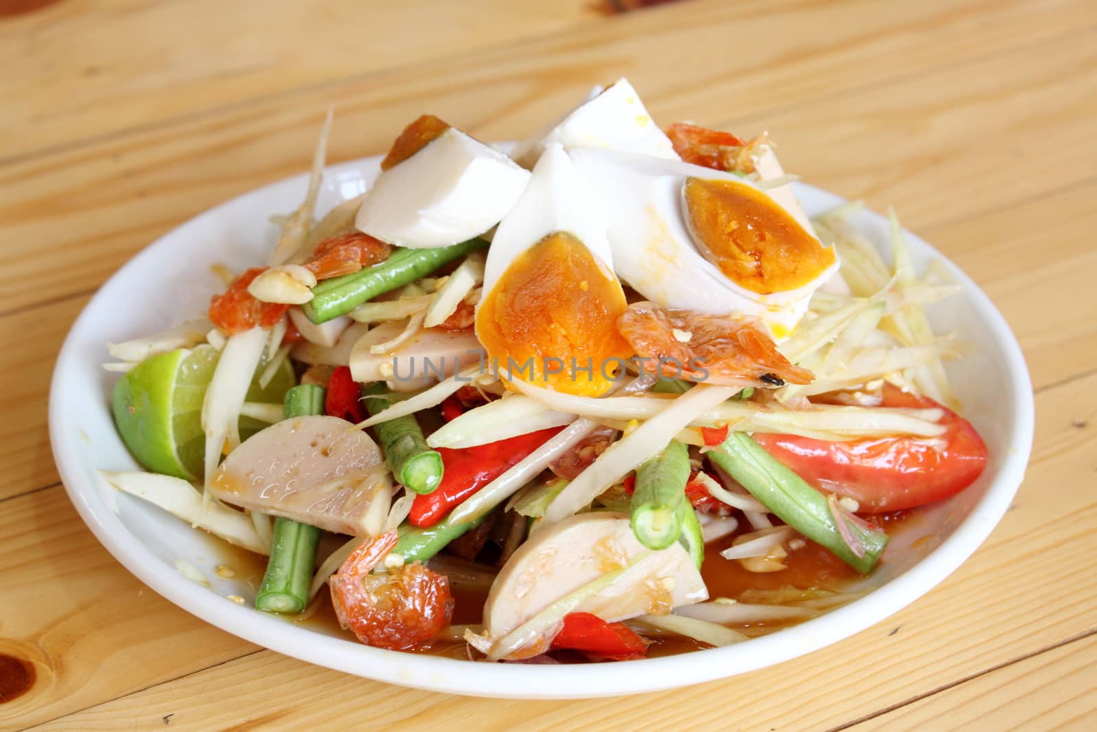 Spicy papaya salad with egg by worrayuth