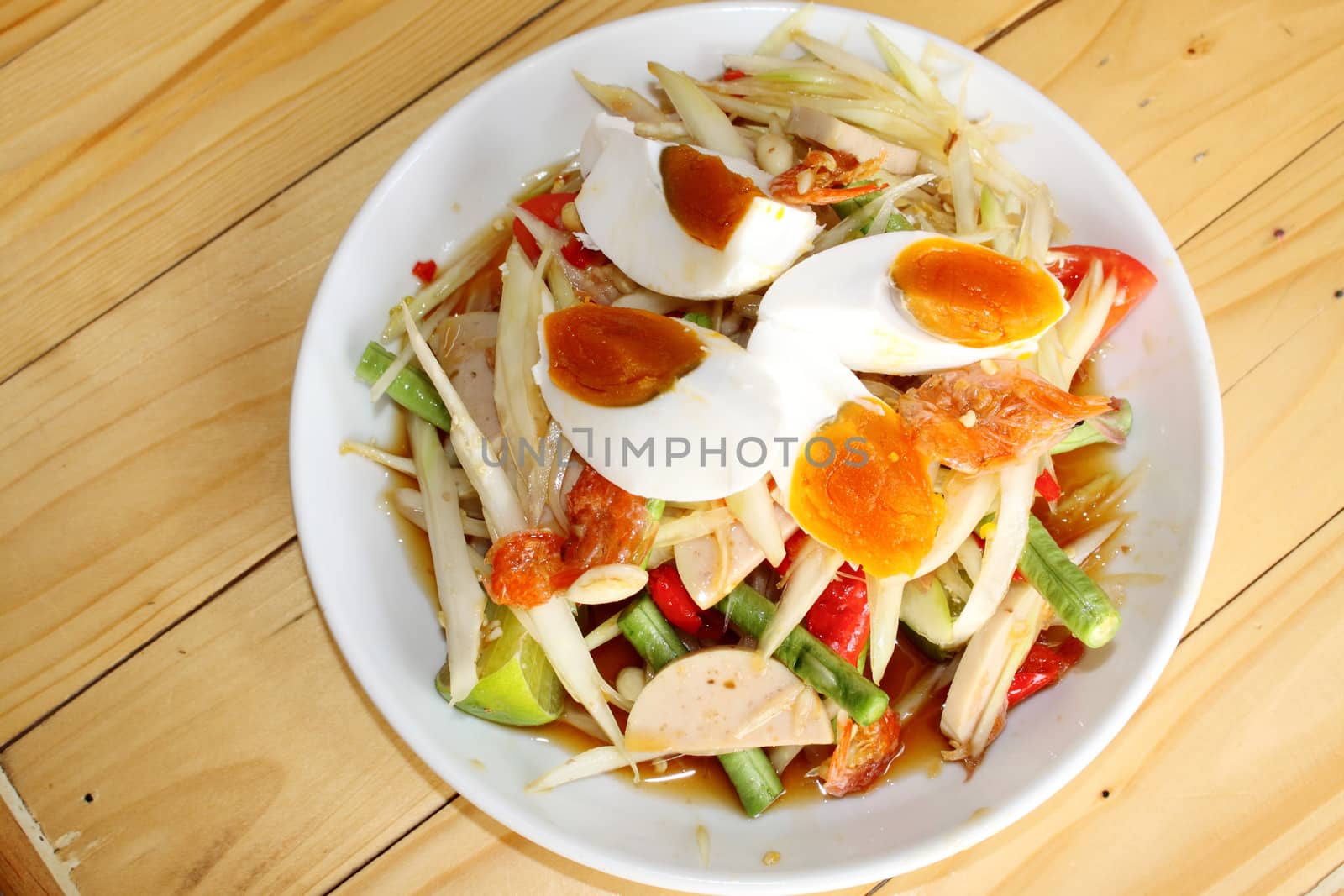 Spicy papaya salad with egg by worrayuth