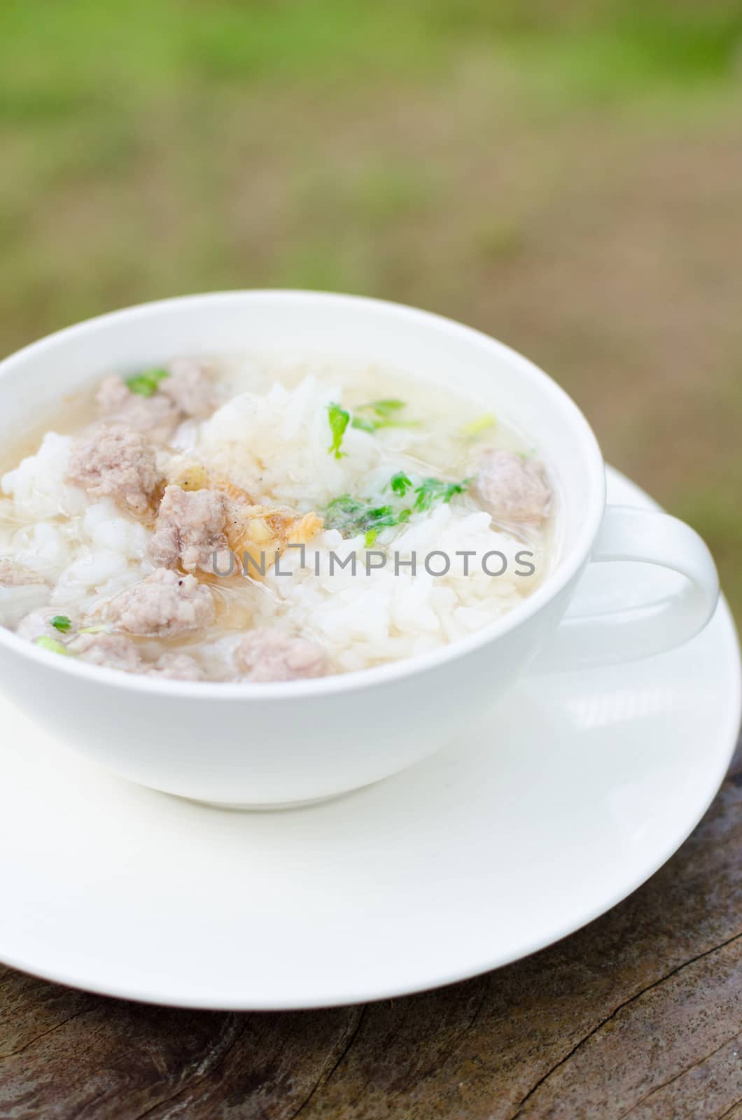 Traditional thai porridge rice gruel in white bowl, congee. Thailand is a popular breakfast.