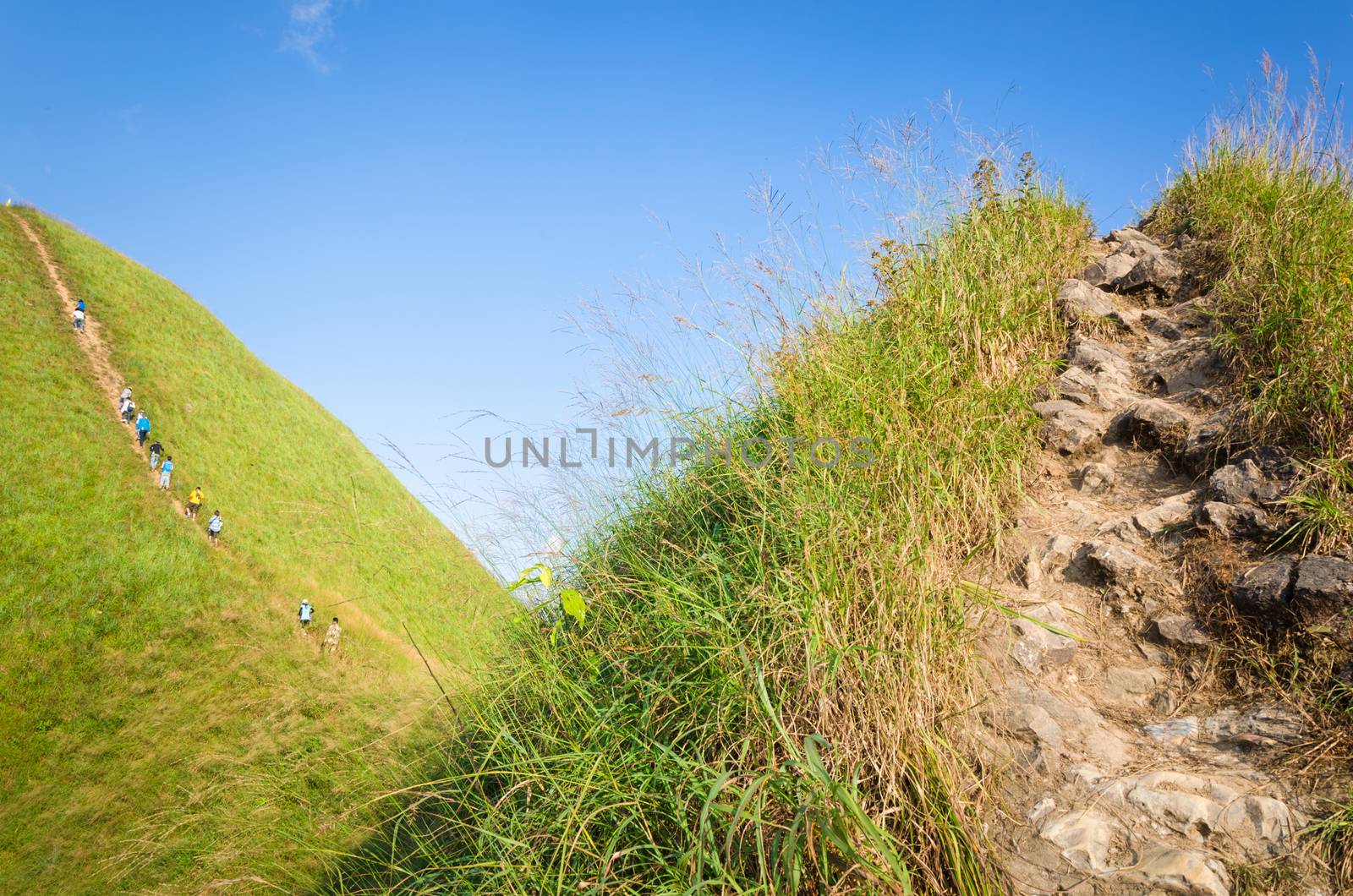 Mountaineer tourists hiking on (Khao Chang Puak) of mountains at Kanchanaburi, Thailand.