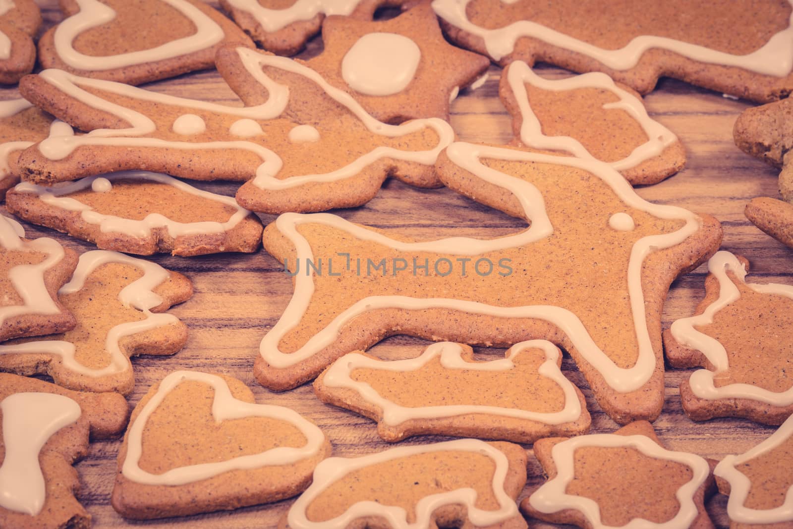 Xmas cookie figures in various shapes on wood