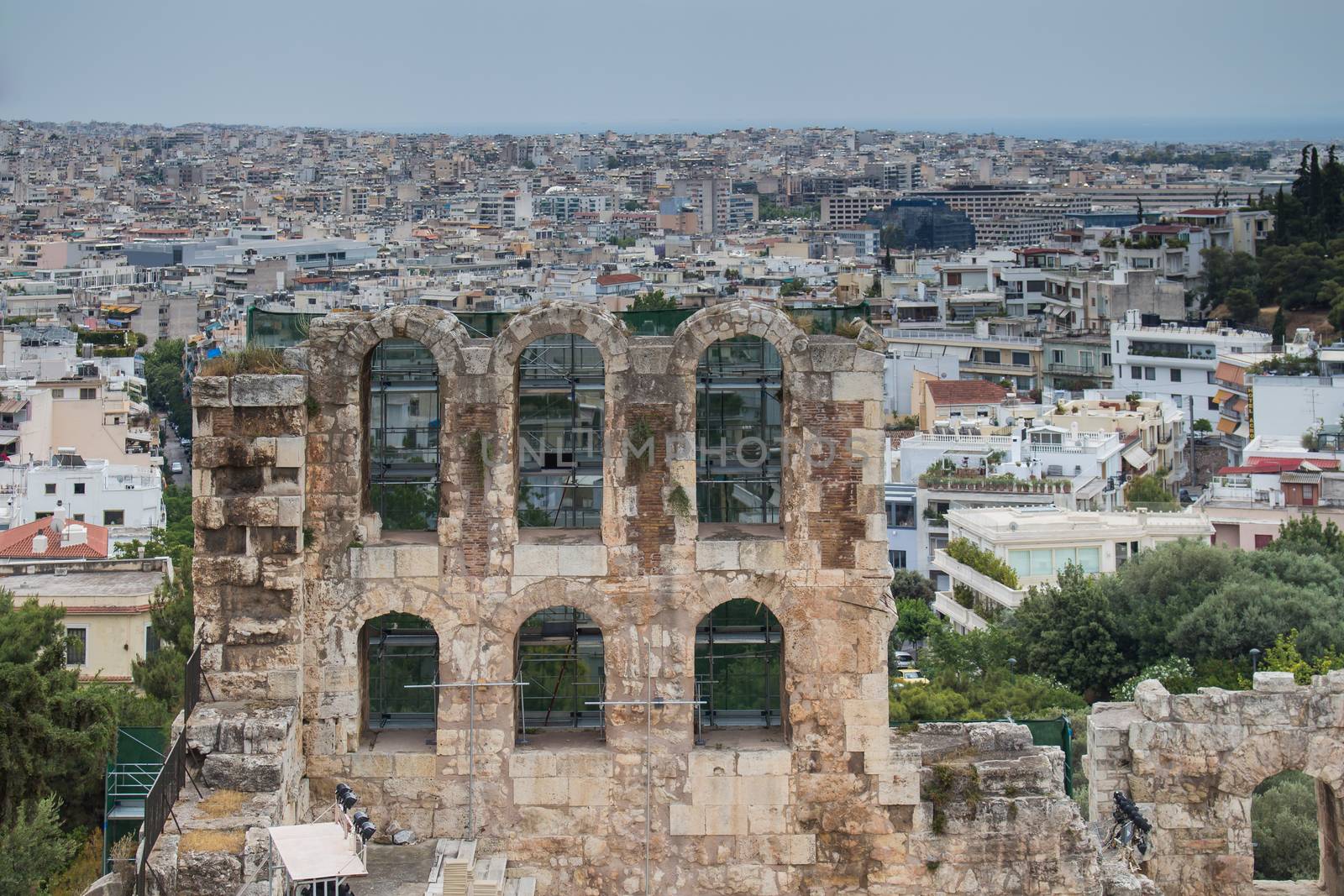 View from Acropolis to the city. In the foreground part of antique building, in the background houses of the greek capital.