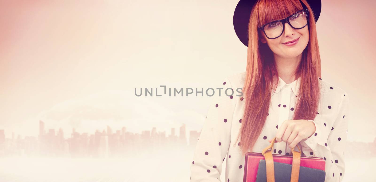 Composite image of smiling hipster woman holding book belt  by Wavebreakmedia