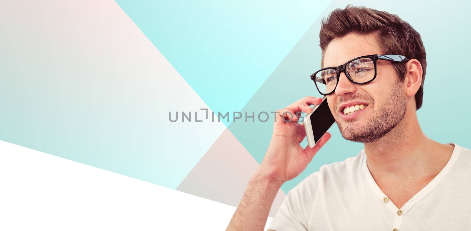 Handsome man using phone against orange background