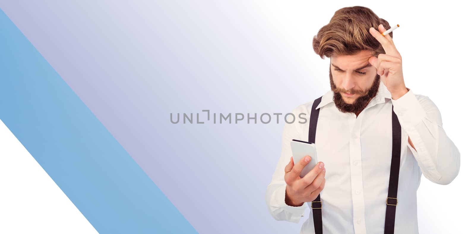 Hipster looking in mobile phonewhile holding cigarette against blue vignette background