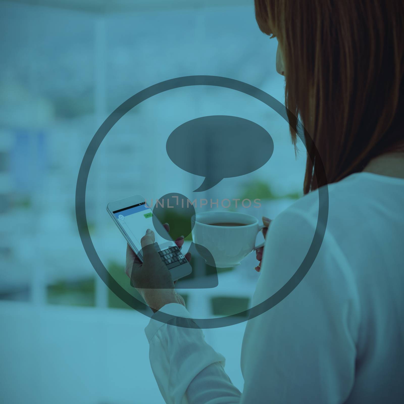 Woman with red hair using smartphone and holding coffee cup  against office