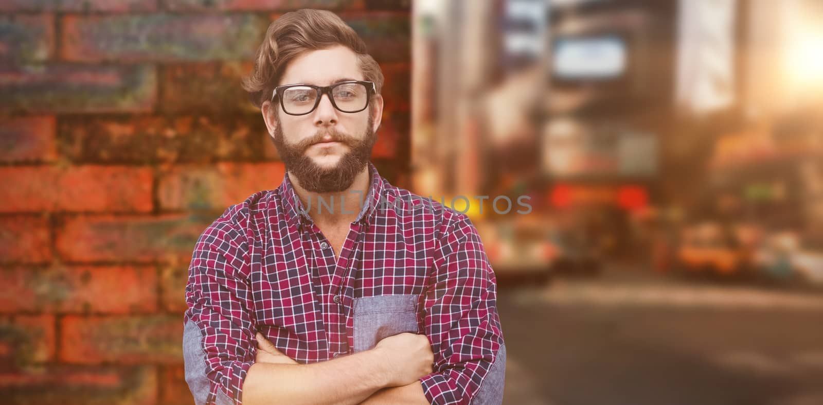 Composite image of confident hipster wearing eye glasses with arms crossed by Wavebreakmedia