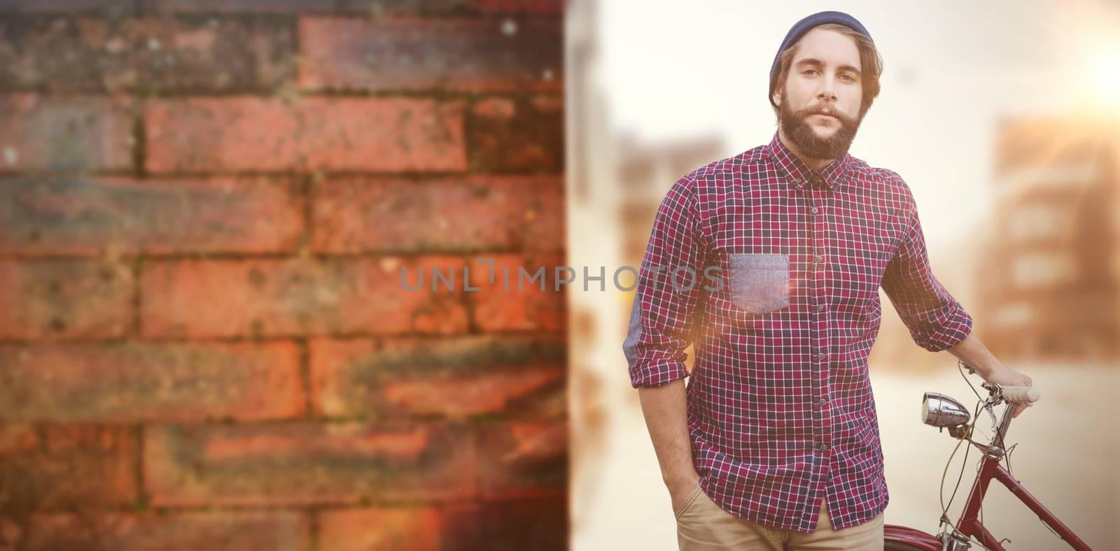 Composite image of portrait of confident hipster with bicycle by Wavebreakmedia