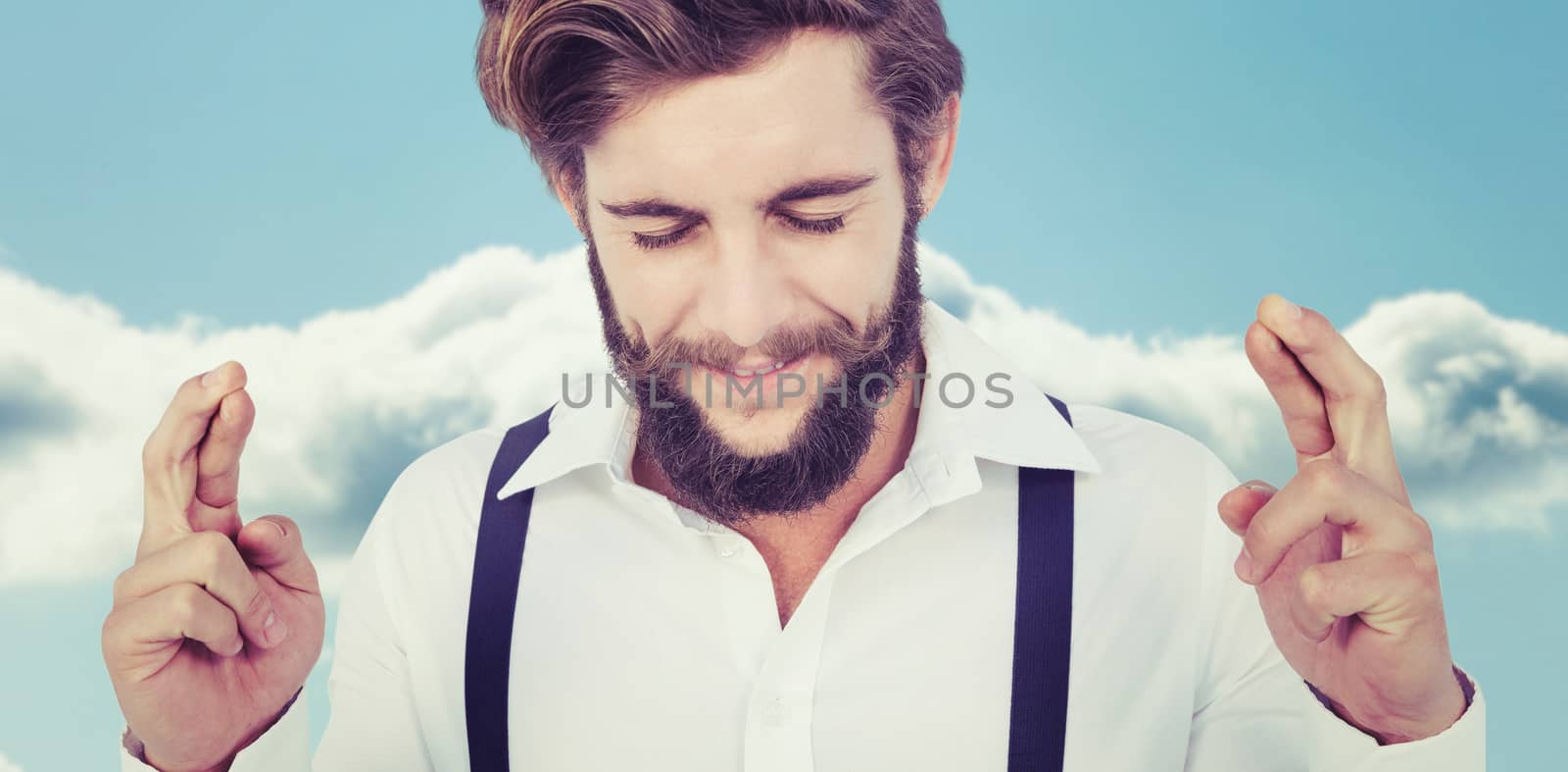 Composite image of hipster with fingers crossed by Wavebreakmedia