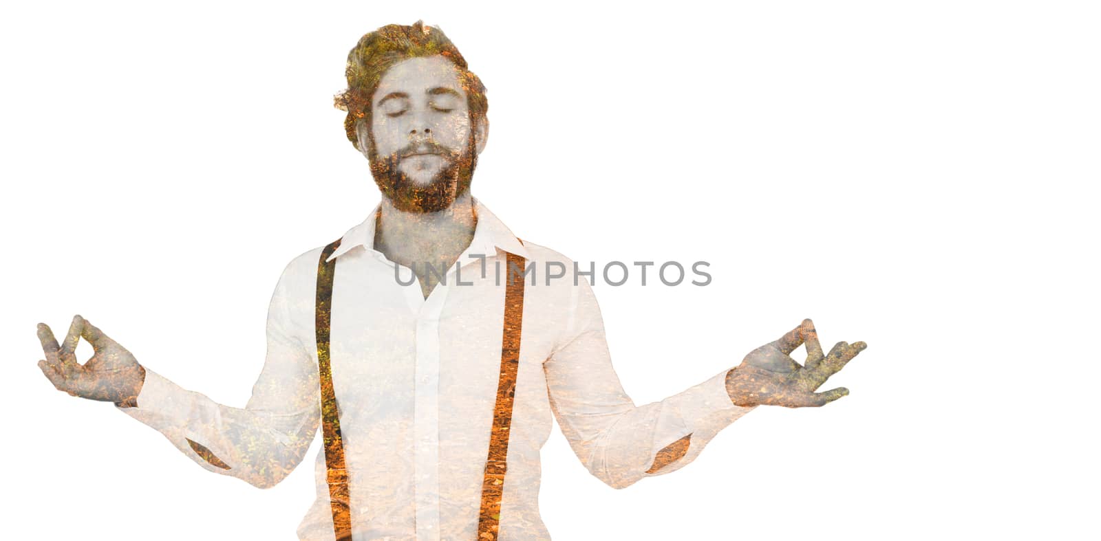 Hipster meditating arms outstretched against autumn scene
