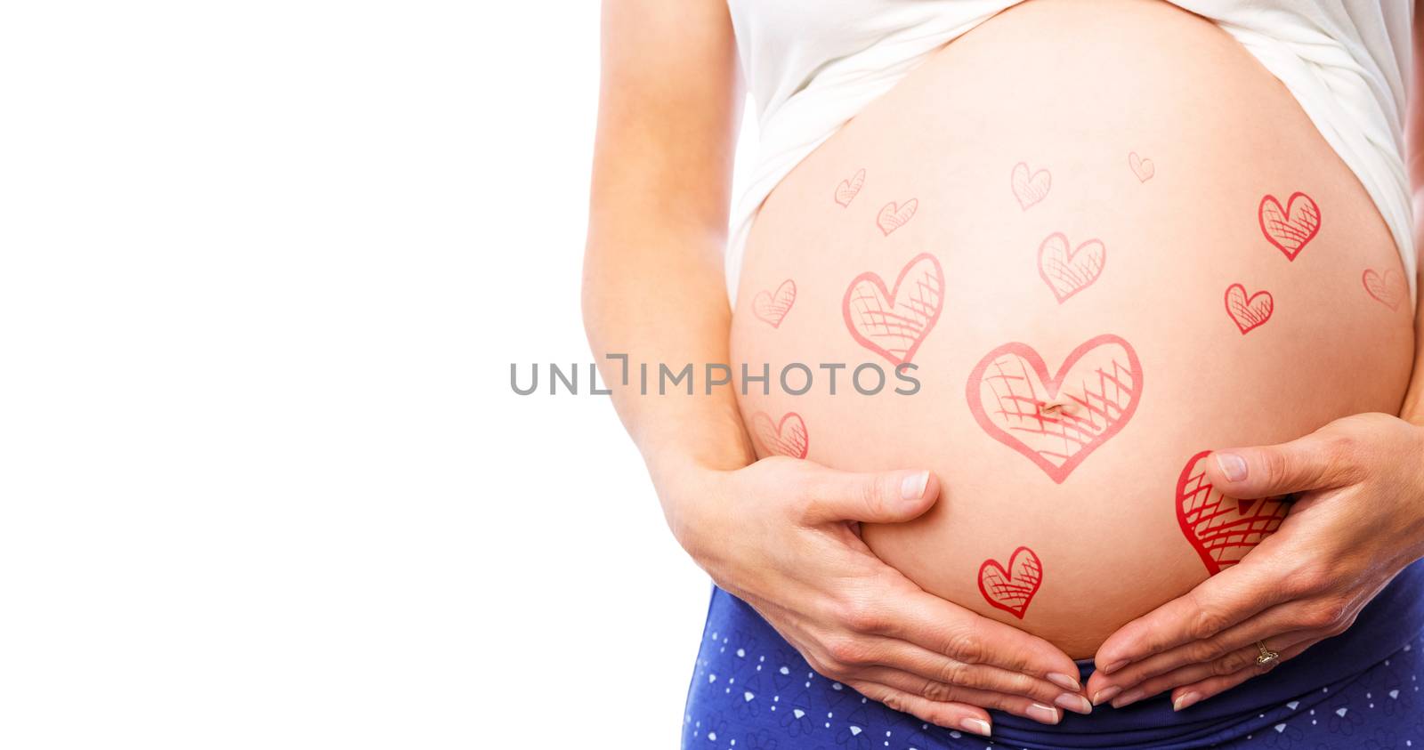 Pregnant woman holding her bump against red hearts