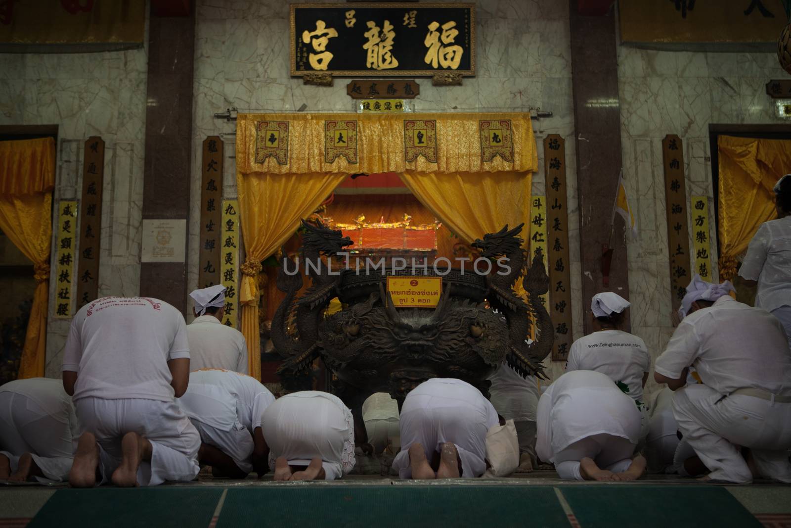 view of people are preying in shrine during vegetarian festival in Thailand