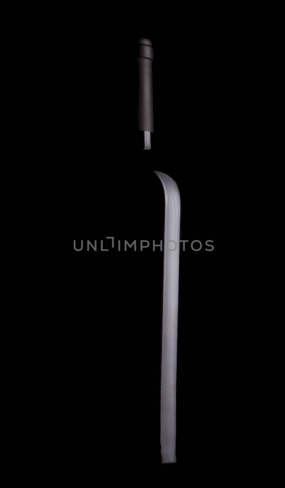 Black wine bottle silhouette with black aluminum cap on black background