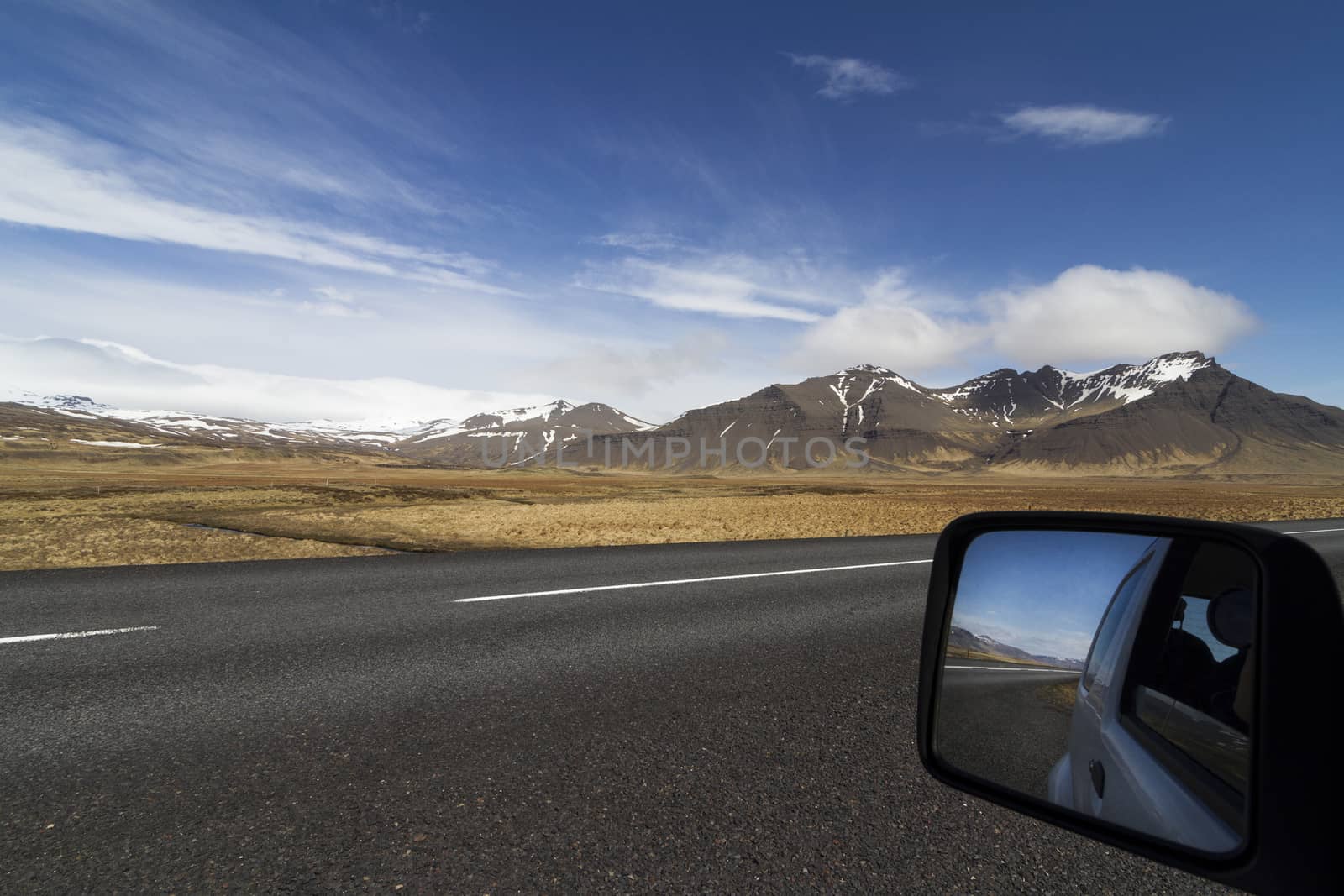 Car mirror on a the ring road in Iceland by macondo